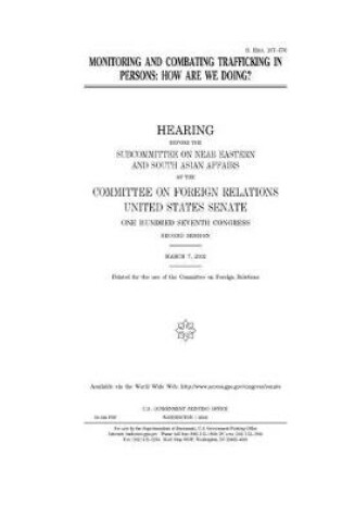 Cover of Monitoring and combating trafficking in persons