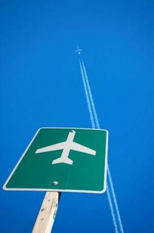 Cover of Airport Sign with Airplane in the Sky Above Journal