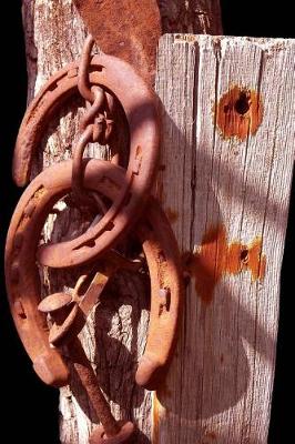 Book cover for Rustic Oxidized Horseshoes on Weathered Wood Journal